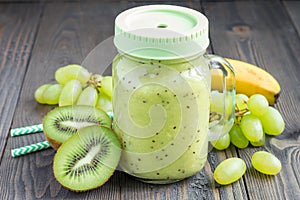 Healthy smoothie with kiwi, green grape, and banana in jar