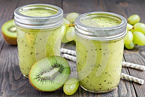 Healthy smoothie with kiwi, green grape, and banana in jars