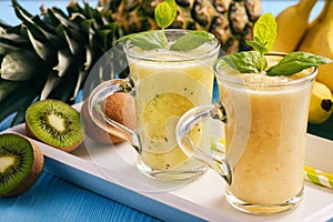 Healthy smoothie with pineaple, kiwi fruit and bananas.