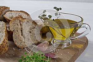 Healthy snack. Cereals bread, olive oil with herb spicy and garlic. Fresh cress salad.