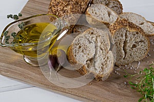 Healthy snack. Cereals bread, olive oil with herb spicy and garlic. Fresh cress salad.