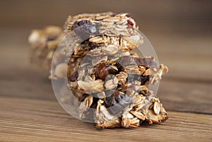 Healthy snack. Close up cereal granola bars with nuts, dried fruits, bannana, honey and oat meal. Isolated.