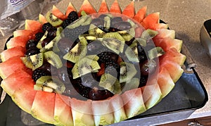 Fresh fruit chopped into watermelon bowl