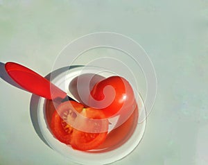 Healthy Snack - Red Tomato Solanum Lycopersicum and Knife on Mottled background