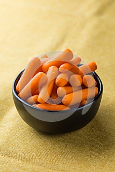 Healthy snacks for workplace lunch: baby carrots. Vegetarian healthy food for office job meal