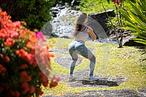 Healthy sport lifestyle. Fit back and buttocks. Athletic young woman in sports dress doing fitness exercise. Fitness