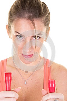 Healthy sports woman in sportswear doing cardio exercises with jump rope to keep fit slim lifestyle