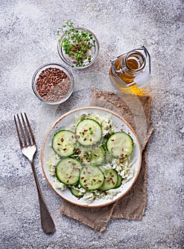 Healthy spring salad with cucumber, flax seed and cress