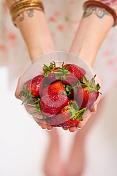 Healthy, strawberry and woman hands with fruit as vegan for protein, organic and balanced diet by eating nutritious