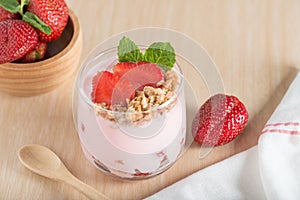 Healthy Strawberry yogurt with fresh strawberries and muesli.
