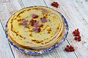 Healthy summer breakfast with homemade classic pancakes with fresh berries, light blue wooden rustic background. Whole weat