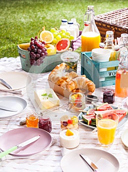 Healthy summer picnic with fruit and croissants