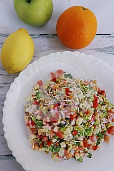 Healthy summer salad with lettuce, tomato, apple, onion bean sprout and chick peas