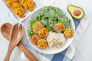 Healthy superbowl or Buddha bowl with salad, baked sweet potatoes