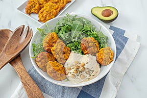 Healthy superbowl or Buddha bowl with salad, baked sweet potatoes