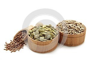 Healthy superfood: sesame, pumpkin seeds, sunflower seeds, flax seeds and chia isolated on white