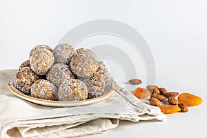 Healthy sweet food. Energy balls in a plate on a white background