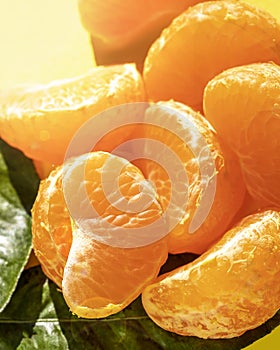 Healthy tangerine segment loaded with vitamin C, ideal for diets. The leaf clementine is a very tasty citrus fruit with an