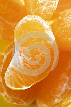 Healthy tangerine segment loaded with vitamin C, ideal for diets. The leaf clementine is a very tasty citrus fruit with an