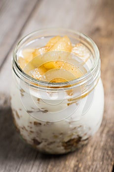 Healthy and tasty breakfast with muesli, yougurt and grilled pears