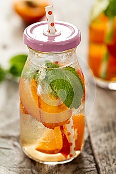 Healthy tasty fresh refreshing detox water in bottles or jars wi