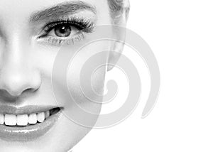 Healthy teeth smile woman beautiful face close up monochrome