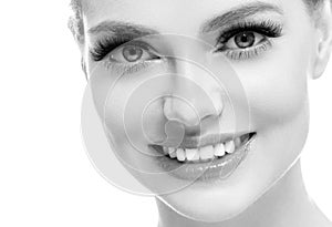 Healthy teeth smile woman beautiful face close up monochrome