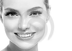 Healthy teeth smile woman beautiful face close up monochrome