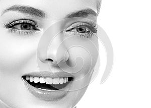 Healthy teeth smile woman beautiful face close up monochrome