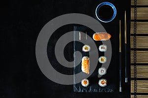 Healthy traditional japanese Sushi set nigiri and rolls with chopsticks