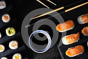 Healthy traditional japanese Sushi set nigiri and rolls with chopsticks