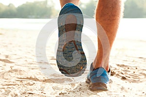 Healthy trail running on the beach coast, foot prints