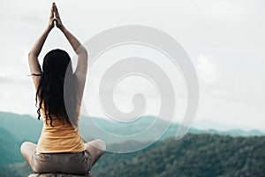 Healthy traveler woman lifestyle balanced practicing meditate and zen energy yoga outdoors in morning the mountain nature.