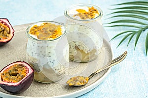 Healthy tropical fruit chia pudding with passionfruit in a glass, Delicious breakfast or snack, Clean eating, dieting, vegan food