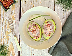 Healthy tuna avocado boats flat lay