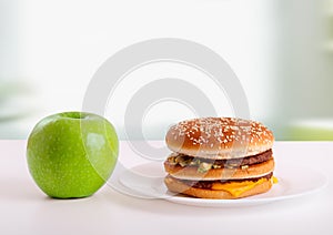 Healthy, unhealthy food. Diet concept: apple, ha