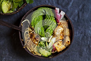 Healthy vegan bowl with tofu and avocado rose