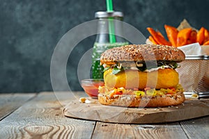 Healthy vegan burger with fresh vegetables and white sauce. With copy space