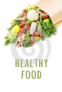 Healthy vegan food in full paper bag, vegetables and fruits on white background, copy space, banner. Shopping food, supermarket,