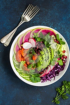 Healthy vegan lunch bowl salad. Avocado, red bean, tomato, cucu
