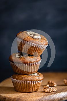 Healthy vegan oat muffins, apple and banana cakes on dark background. Close up, Bakery concept