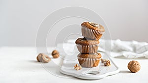 Healthy vegan oat muffins, apple and banana cakes on a wooden background. Copy space