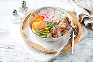Healthy Vegan Poke bowl salad, heura vegetable protein, vegan chicken with variety vegetables, rice, served in bowl