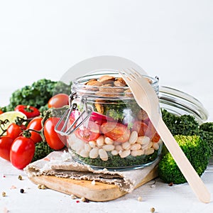Healthy vegan salad in a mason jar with beans