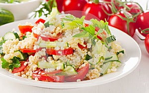 Healthy vegetable salad on a white plate.