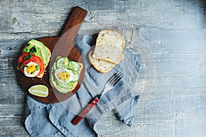 healthy vegetarian breakfast, avocado toast with cucumber, eggs