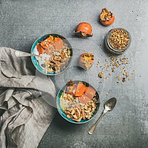 Healthy vegetarian breakfast over grey concrete background, square crop