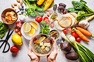 Healthy vegetarian food background. Vegetables, pesto and lentil curry with tofu