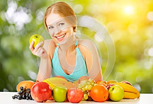 Healthy vegetarian food. happy woman eating apple in summer