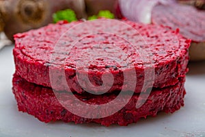 Healthy vegetarian food, raw round burgers made from red beetroot